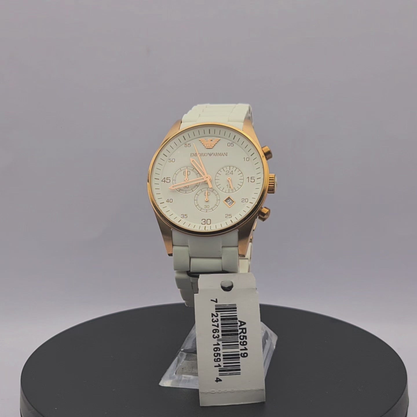 360-degree rotating view of Emporio Armani AR5919 men's white and rose gold chronograph watch with white silicone-wrapped bracelet.