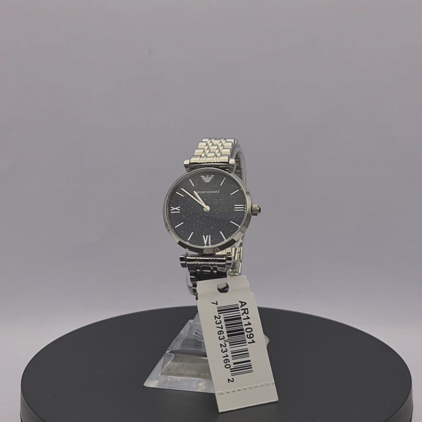 360-degree rotating view of Emporio Armani AR11091 women's silver stainless steel mesh watch with navy blue dial.