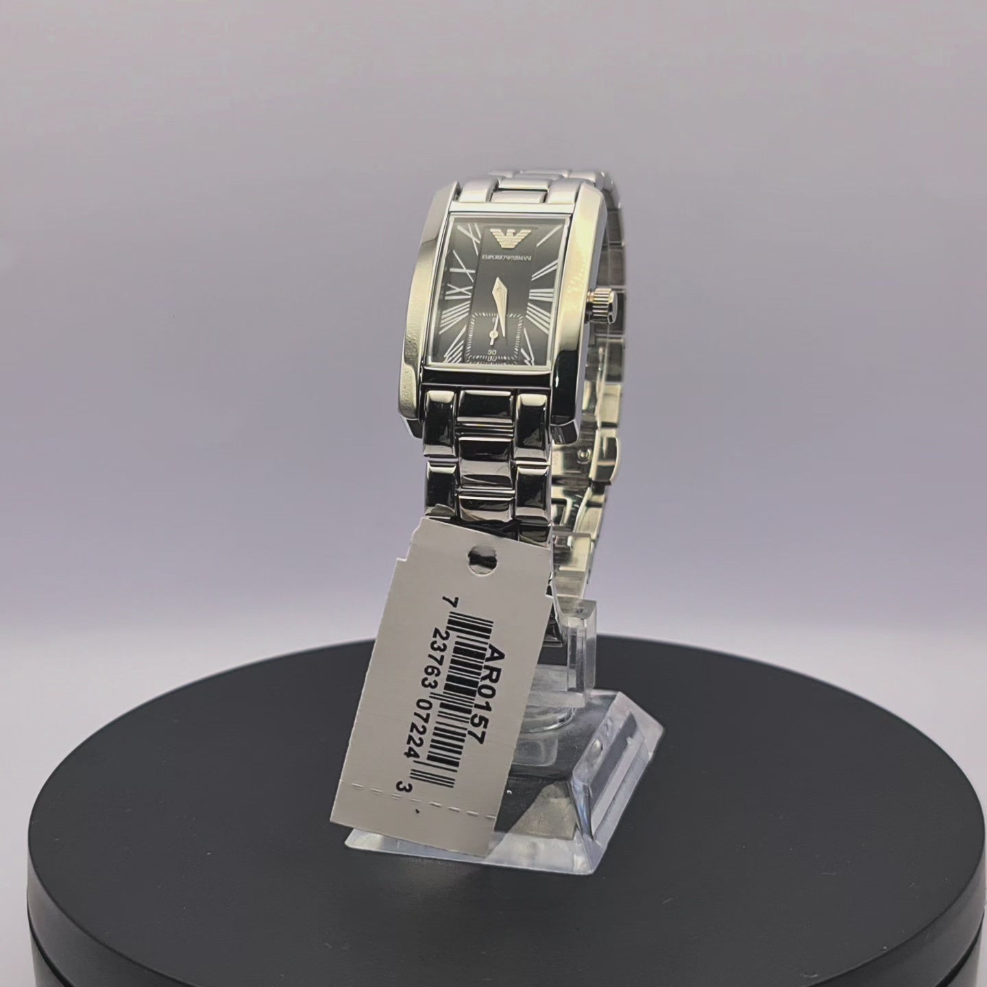 360-degree rotating view of Emporio Armani AR0157 women's silver stainless steel watch with black dial and rectangular case.