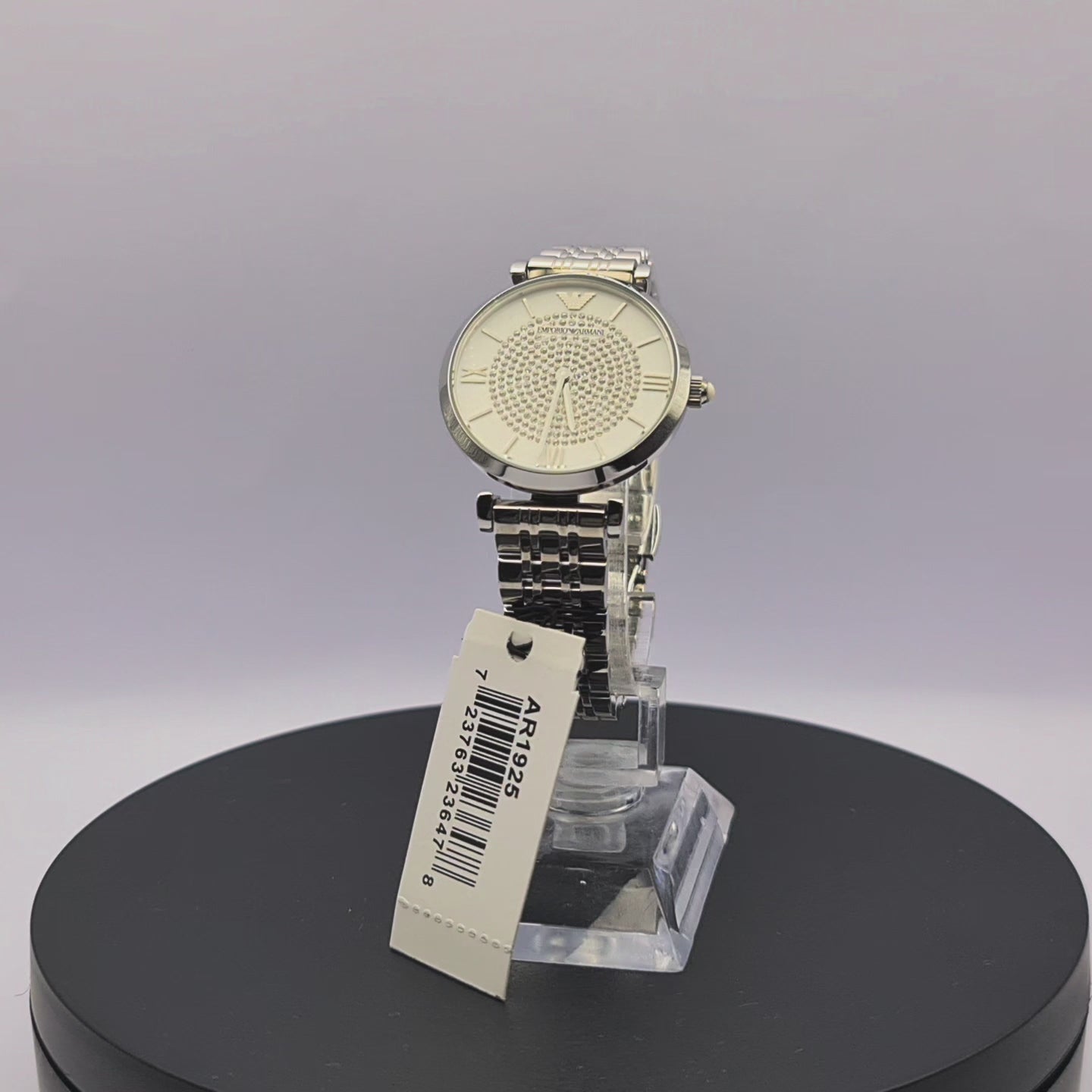 360-degree rotating view of Emporio Armani AR1925 women's silver stainless steel watch with white dial and crystal pavé center.
