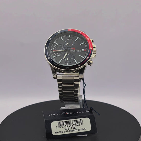 360-degree rotating view of Tommy Hilfiger 1791718 Bank watch with silver stainless steel bracelet and blue dial.