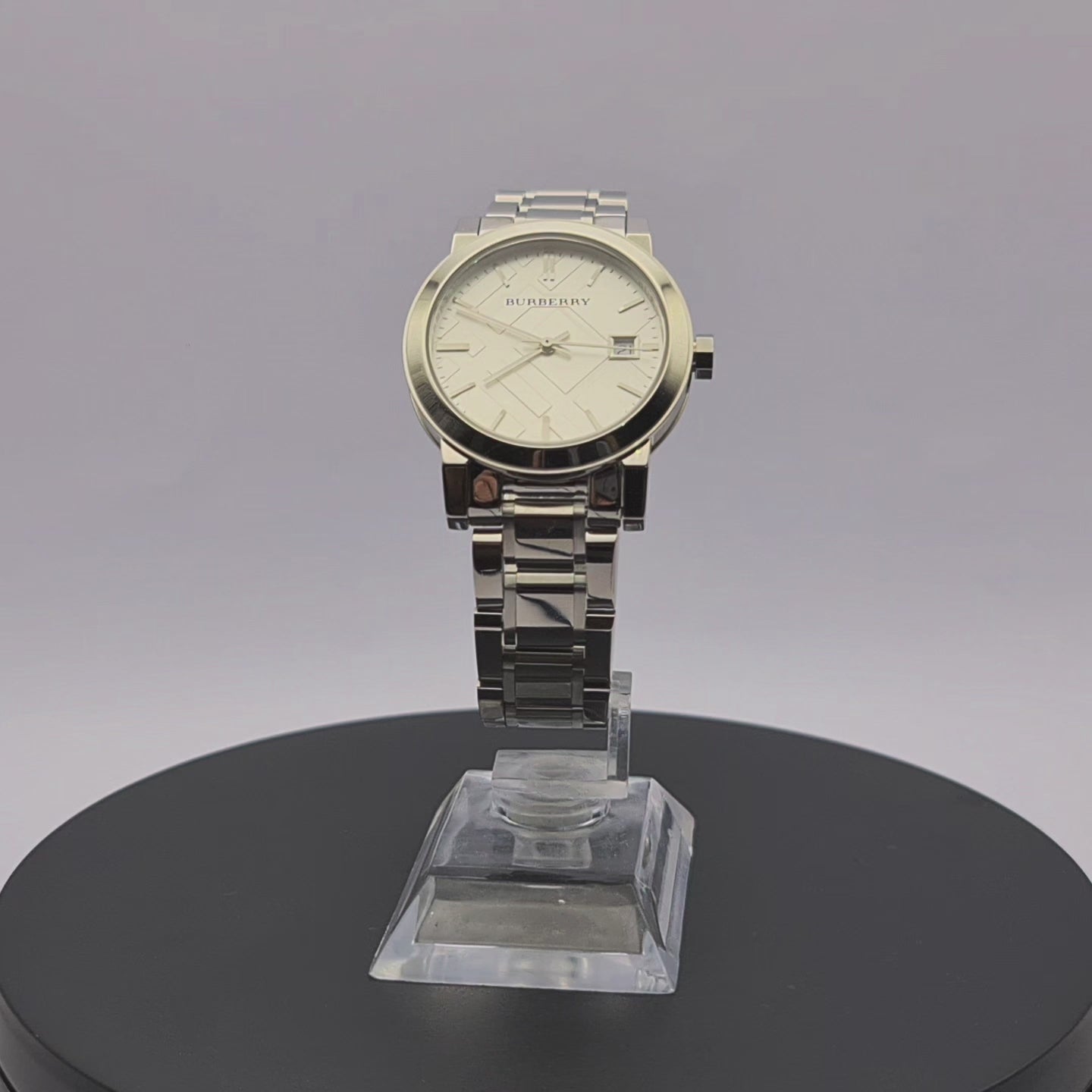 360-degree rotating view of Burberry BU9100 women's silver stainless steel watch with check dial.