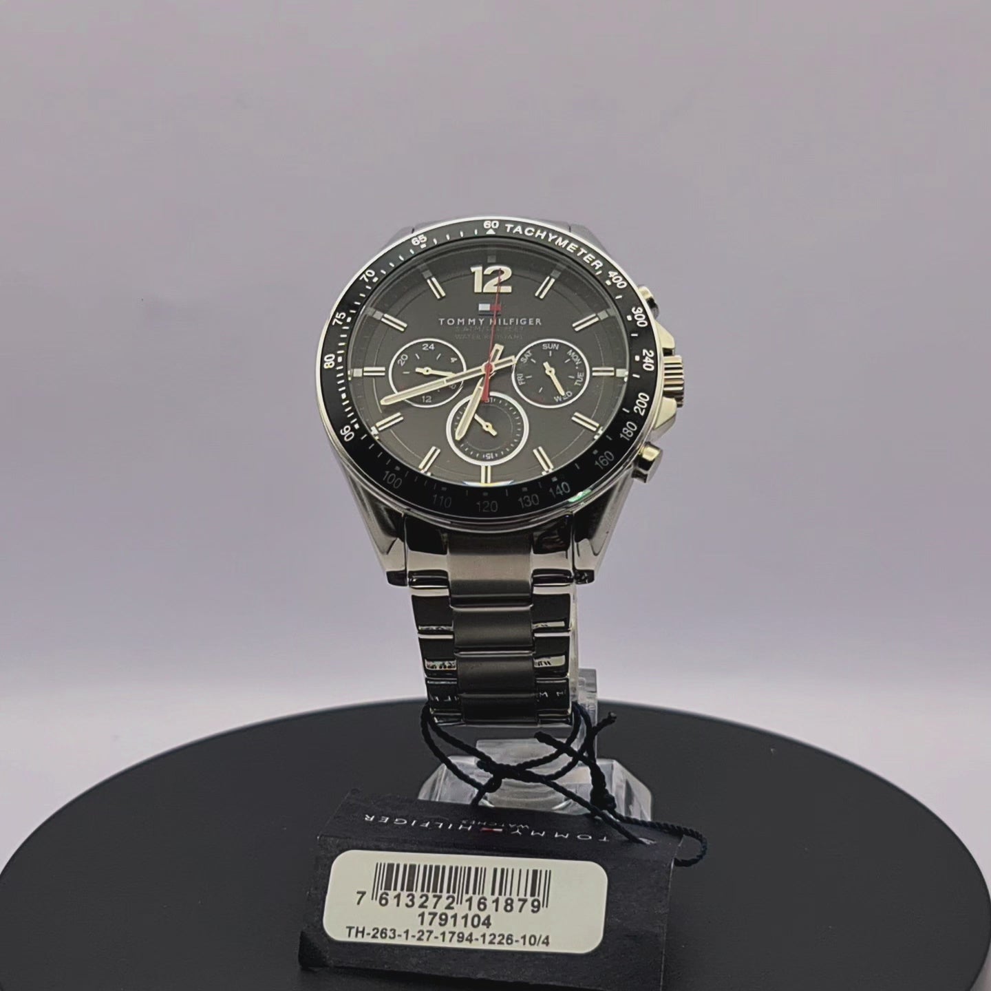 360-degree rotating view of Tommy Hilfiger 1791104 men's silver stainless steel watch with white dial and brown leather strap