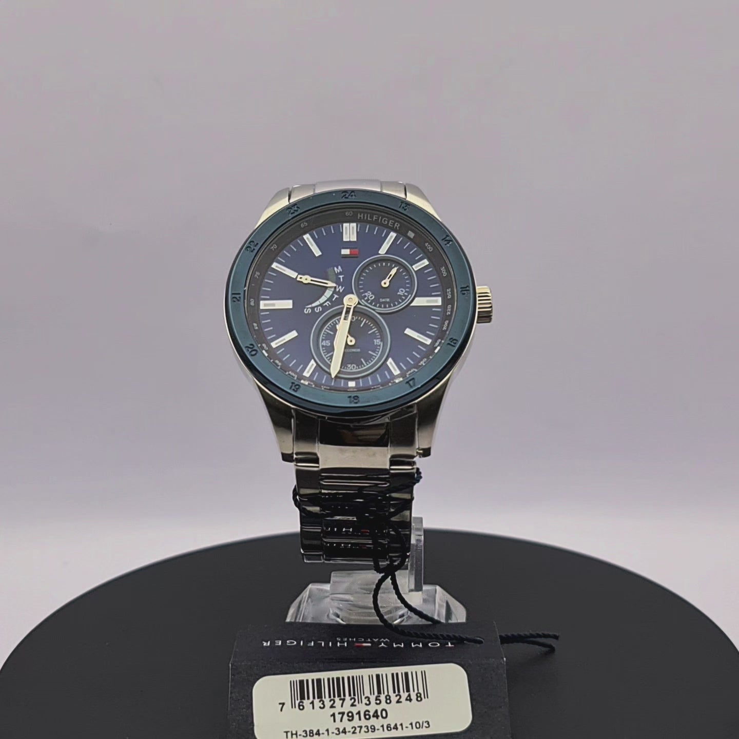 360-degree rotating view of Tommy Hilfiger 1791640 men's blue ion-plated watch with stainless steel mesh bracelet.