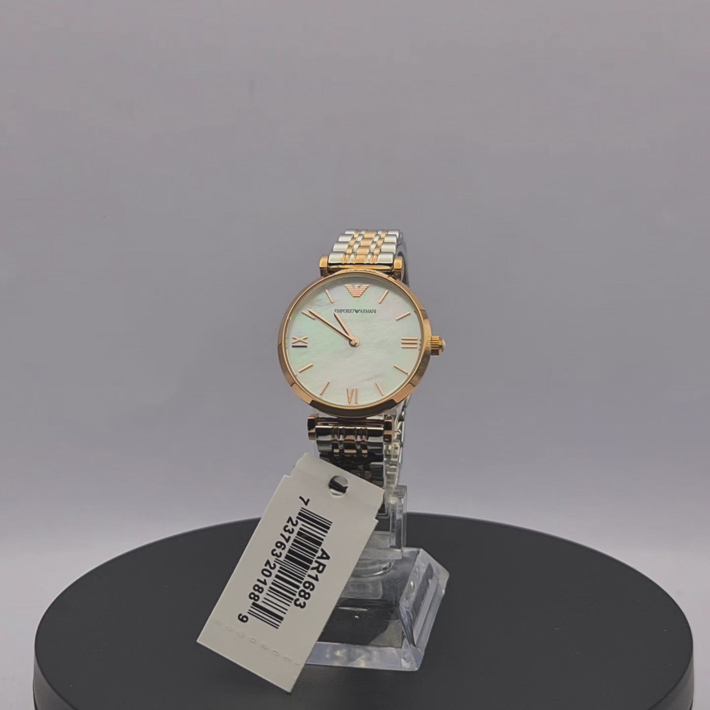 360-degree rotating view of Emporio Armani AR1683 women's two-tone stainless steel watch with white mother-of-pearl dial.