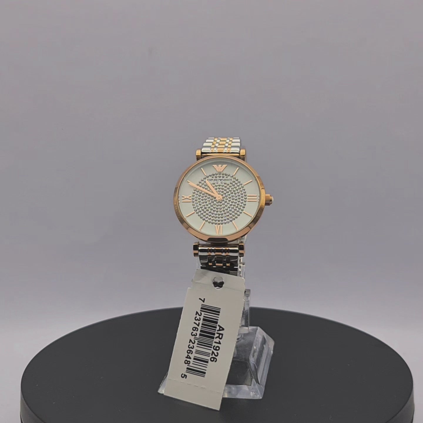 360-degree rotating view of Emporio Armani AR1926 women's two-tone stainless steel watch with white dial and crystal pavé center.