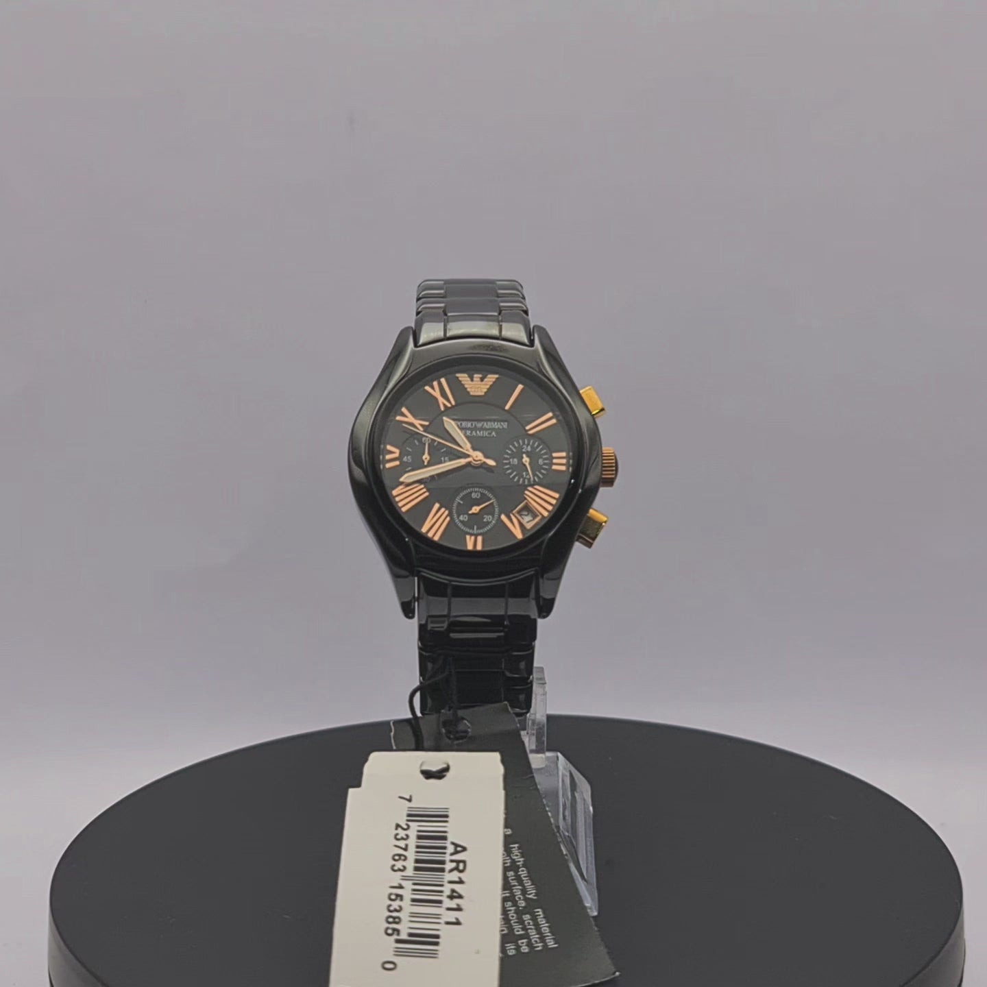 360-degree rotating view of Emporio Armani AR1411 women's black ceramic chronograph watch with black dial and rose gold-tone Roman numeral hour markers.