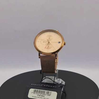 360-degree rotating view of Tommy Hilfiger 1781944 women's gold-tone watch with white dial and white silicone strap.