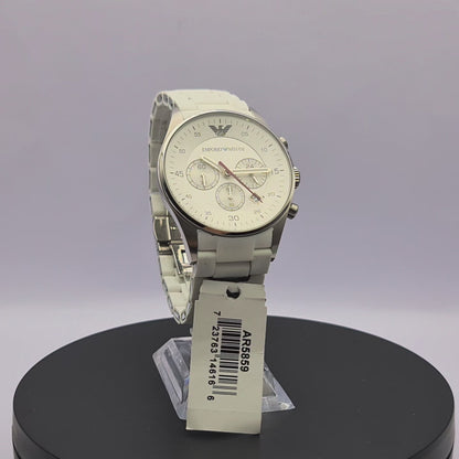 360-degree rotating view of Emporio Armani AR5859 men's silver stainless steel chronograph watch with white dial and white silicone-wrapped bracelet.