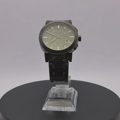 360-degree rotating view of Burberry BU9354 gunmetal chronograph watch with stamped check dial pattern.