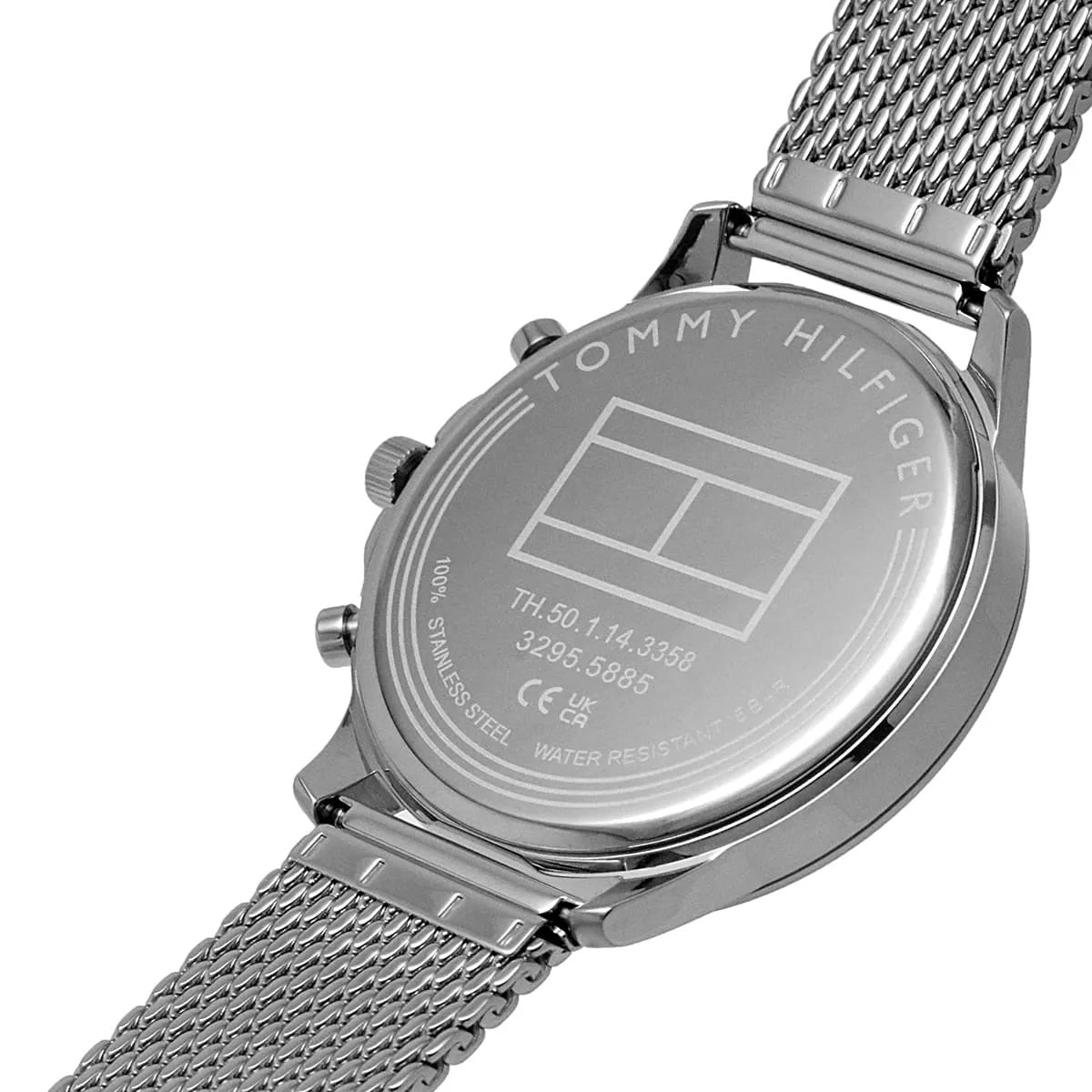 Close-up view of the polished silver-tone case back of the Tommy Hilfiger 1710499 featuring the official logo engraving.