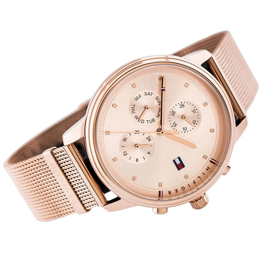 Angled view of the Tommy Hilfiger Blake watch showcasing the polished rose gold-tone case and intricate stainless steel mesh strap.