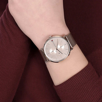 Tommy Hilfiger 1781944 women’s rose gold mesh strap watch worn on wrist, featuring a stylish rose gold dial