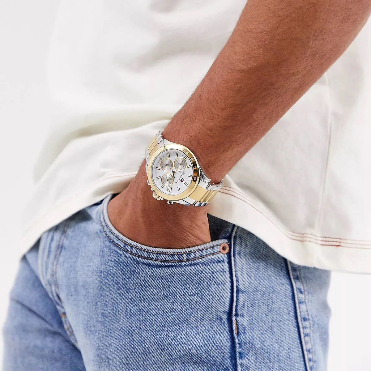 Tommy Hilfiger 1791226 two-tone men's watch with white dial worn on wrist