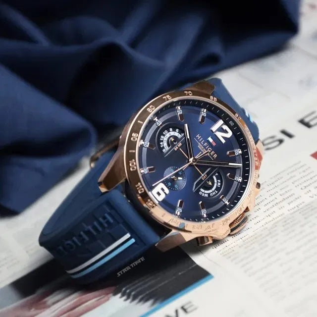 Angled view of Tommy Hilfiger 1791474 showing blue dial and rose gold bezel