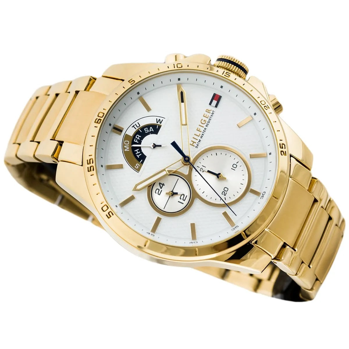 Close-up of white dial on Tommy Hilfiger 1791538 men's watch with gold accents