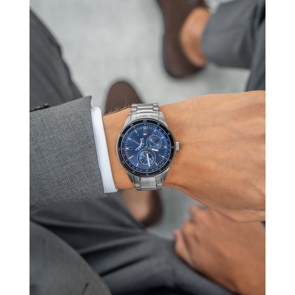 Tommy Hilfiger 1791640 men's watch on wrist with silver strap and blue dial