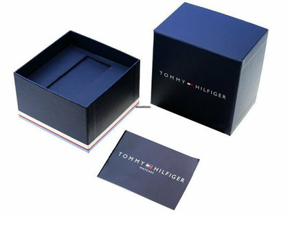 Open Tommy Hilfiger watch box with watch inside, showing interior design