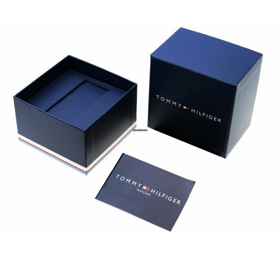 Open Tommy Hilfiger watch box with watch inside, showing interior design